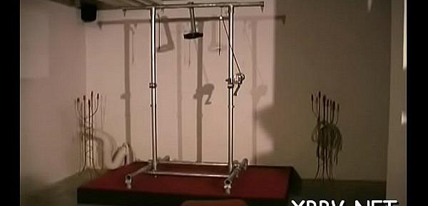  Woman stands with her wobblers tied up in hot bondage scenes